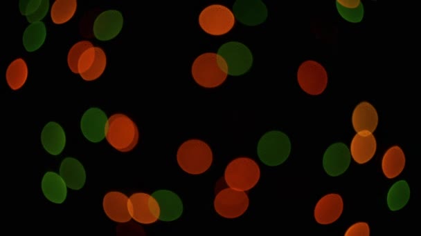 Taches de lumière multicolores sur fond noir 
