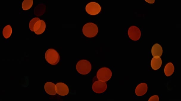 Taches de lumière multicolores sur fond noir 