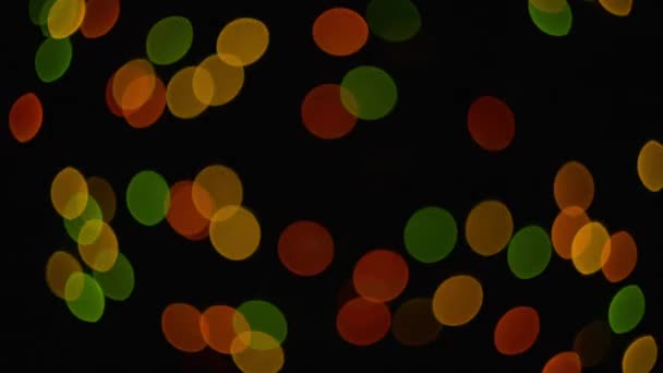 Taches de lumière multicolores sur fond noir 