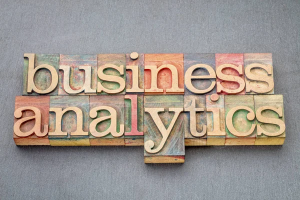 Business analytics in wood type — Stock Photo, Image
