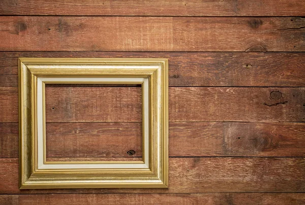 Picture frame against rustic wood — Stock Photo, Image