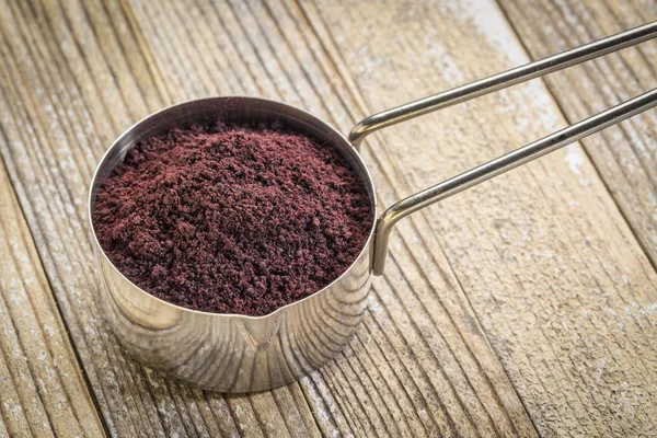 Scoop of acai berry powder — Stock Photo, Image
