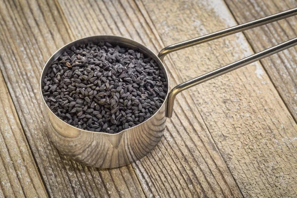 Cuillère de graines de cumin noir — Photo