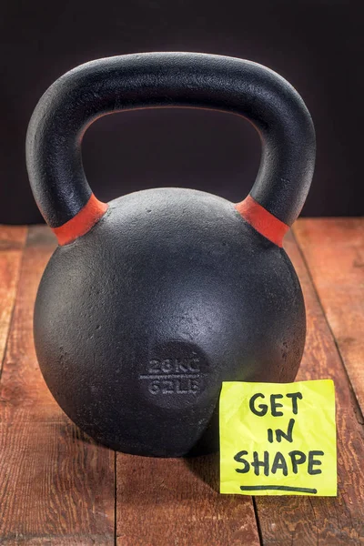 Get in shpae with heavy iron kettlebell — Stock Photo, Image