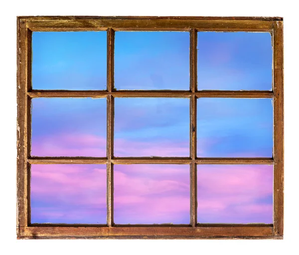 Sunset sky as seen through old window — Stock Photo, Image