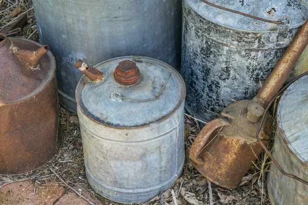 vintage rusty oil cans