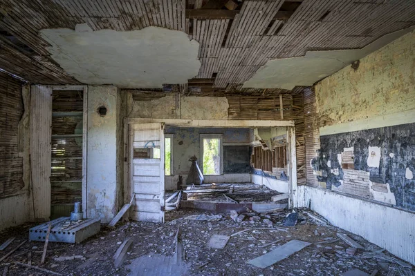 ruined interior of an old abandoned school house