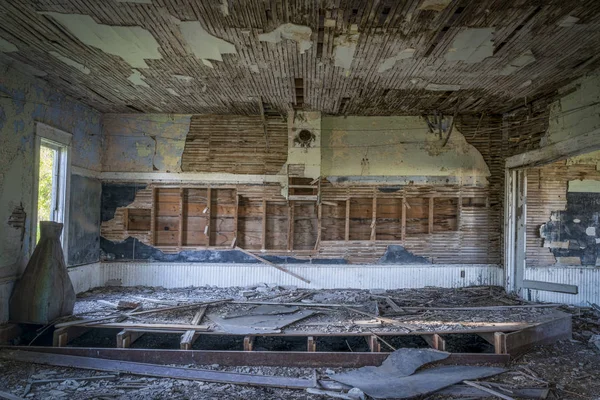 Ruined interior of an old abandoned school house — Stock Photo, Image