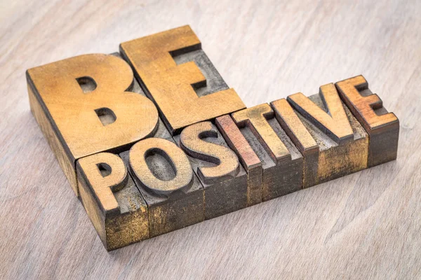Be positive word abstract in wood type — Stock Photo, Image