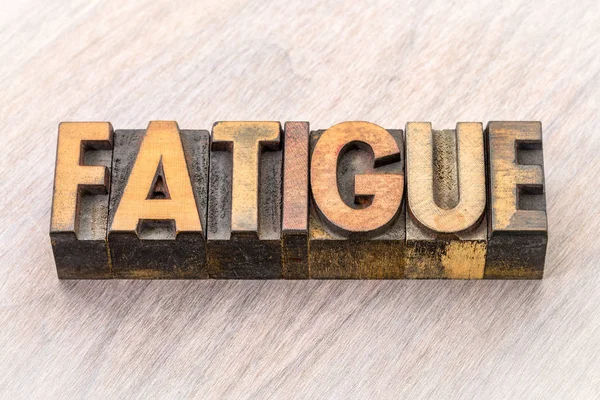 Fatigue word abstract in wood type — Stock Photo, Image