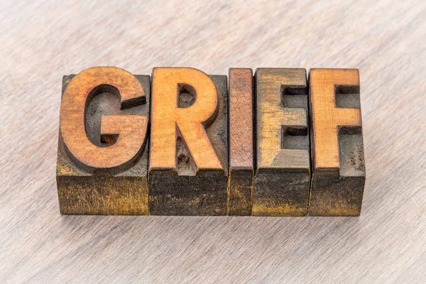 Grief word abstract in wood type — Stock Photo, Image