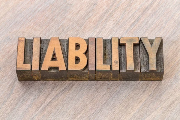 Liability word abstract in wood type — Stock Photo, Image