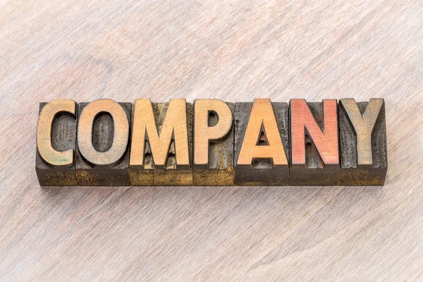 company word abstract in wood type