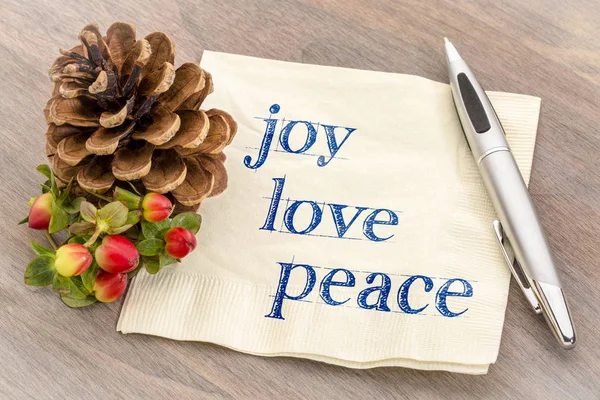 joy, love, peace text on napkin