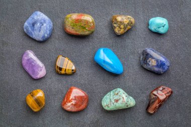 colorful gemstones on slate stone clipart