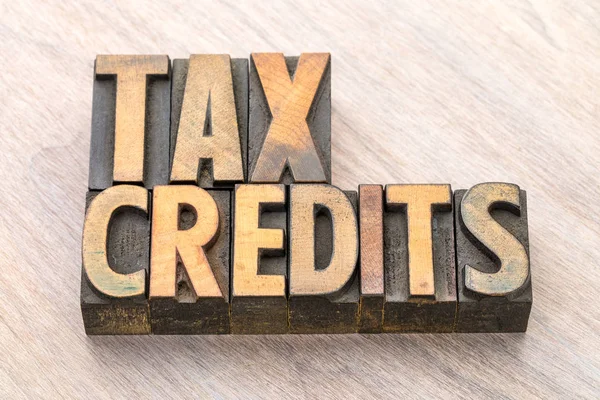Tax credits word abstract in wood type — Stock Photo, Image