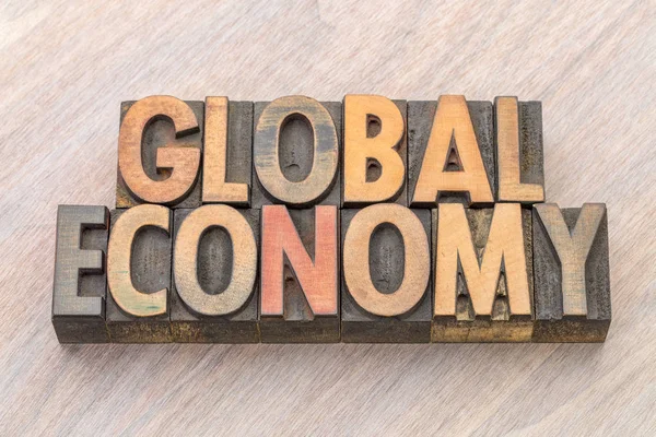 global economy word abstract in wood type