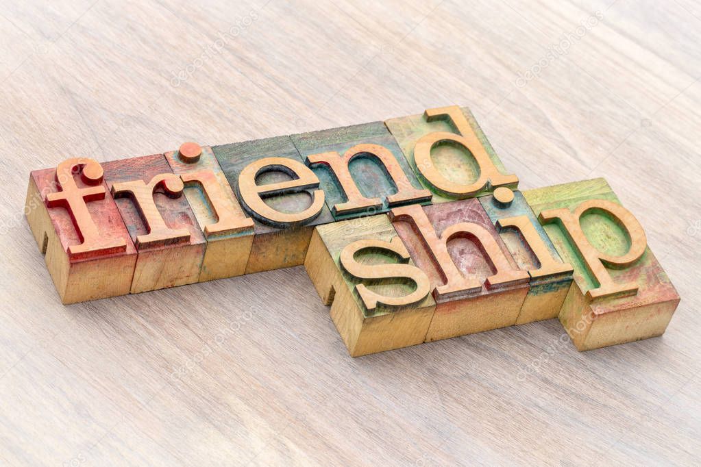 friendship word abstract in wood type