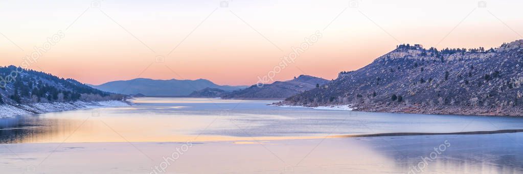 calm winter dusk over mountain lake