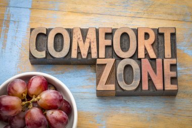 comfort zone word abstract in wood type clipart