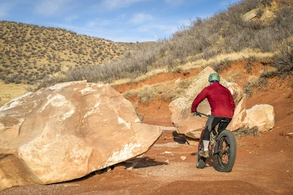 Riding a fat bike on mountain desert trail — Stock Photo, Image