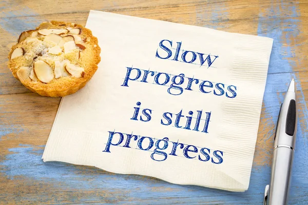 Slow progress is still ... quote on napkin — Stock Photo, Image