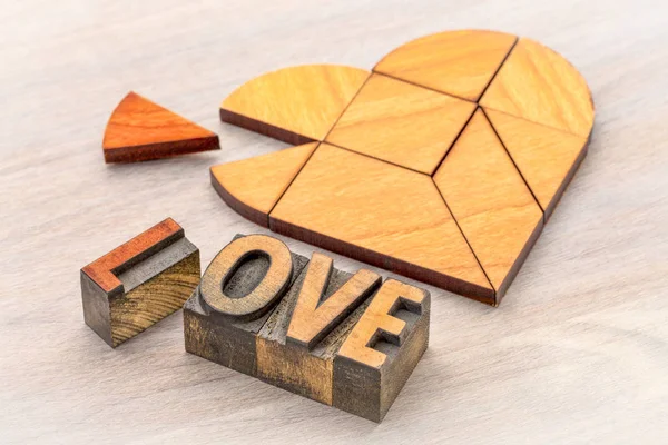 Heart tangram puzzle with love word — Stock Photo, Image