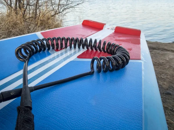 Coil safety leash on paddleboard — Stock Photo, Image