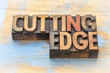 cutting edge word abstract in wood type clipart