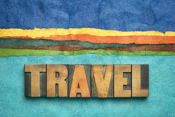 Travel concept in wood type and handmade paper — Stock Photo, Image