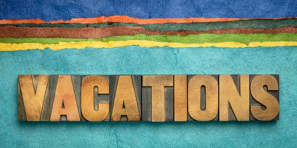 Vacations concept in wood type and handmade paper — Stock Photo, Image