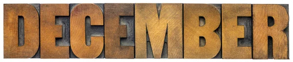 Prosincové slovo abstraktní ve dřevěném provedení — Stock fotografie