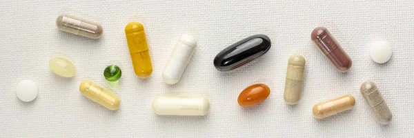 Vitamins and supplements background — Stock Photo, Image
