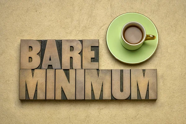 Bare minimum - word abstract in wood type — Stock Photo, Image