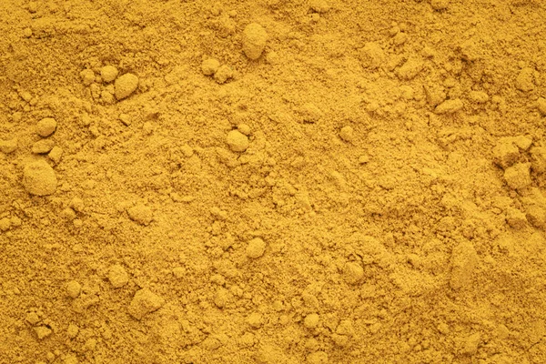 Turmeric root powder background and texture — Stock Photo, Image