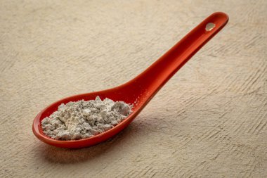 food grade diatomaceous earth supplement on a spoon clipart