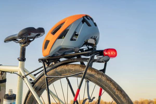 Biking helmet on racks of a touring bike — Stock Photo, Image