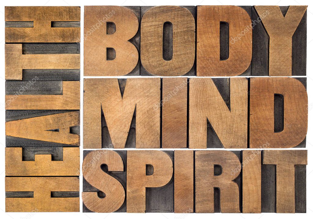 health, body, mind and spirit word abstract - a collage of isolated text in vintage wood letterpress printing blocks, holistic approach to wellbeing concept