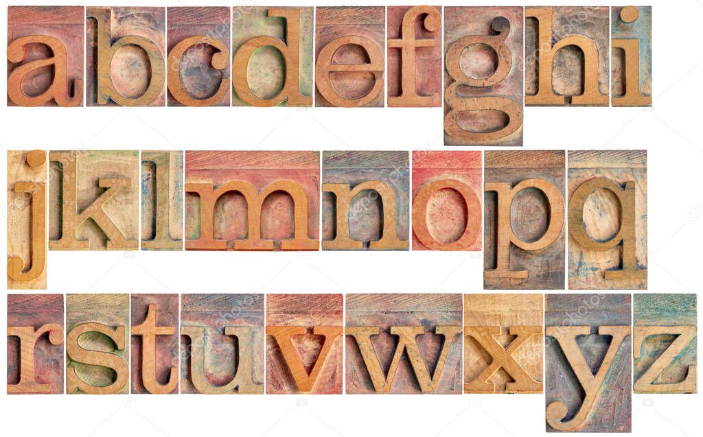 complete English lowercase alphabet - a high resolution collage of 26 isolated vintage wood letterpress printing blocks, stained by color inks