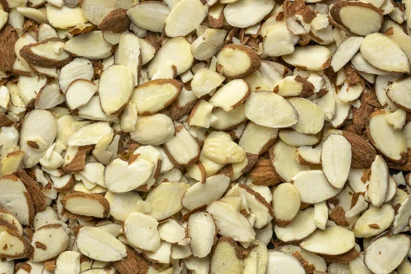 Raw Sliced Almond Nuts Closeup Background — Stock Photo, Image