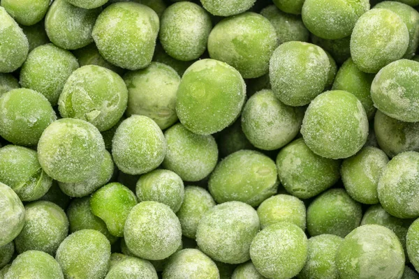 凍結した緑のエンドウ豆の密接な背景 — ストック写真