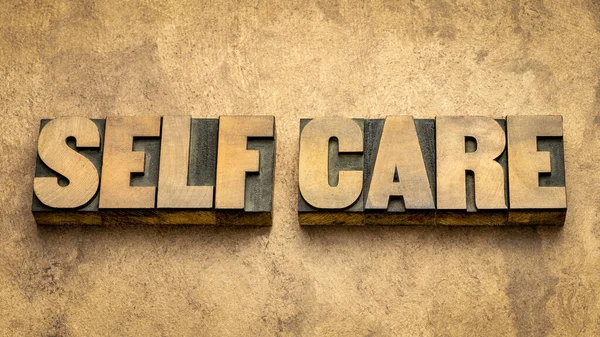 Self Care Word Abstract Vintage Letterpress Wood Type Againts Grunge — Stock Photo, Image