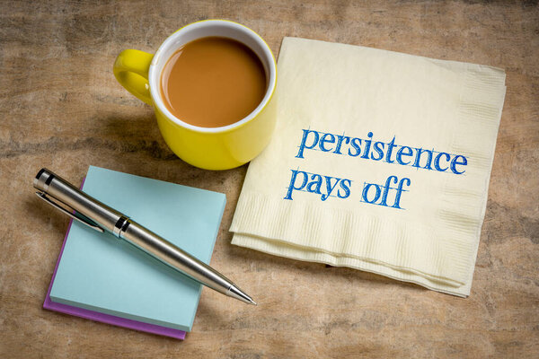 persistence pays off inspirational note - handwriting on a napkin with coffee, determination and success concept