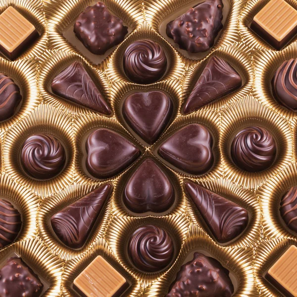 Chocolate box with chocolates in shape of hearts