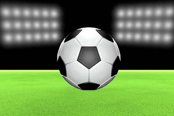 Bola de futebol sobre campo com luzes de estádio na parte de trás — Fotografia de Stock
