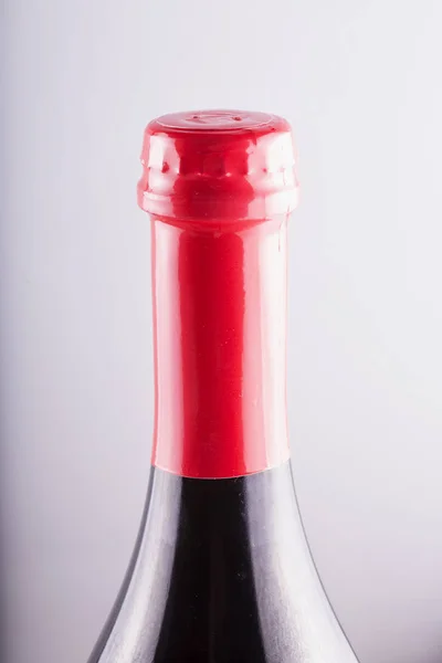 Bottle neck with red cap
