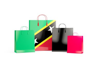 Saint kitts ve nevis bayrağı üzerinde alışveriş torbaları