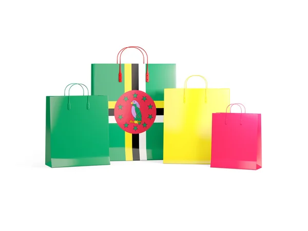 Bandera de dominica en bolsas de compras —  Fotos de Stock