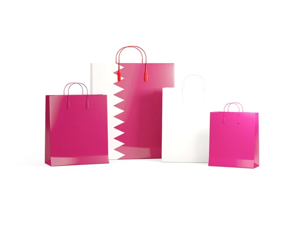 Katar bayrağı üzerinde alışveriş torbaları — Stok fotoğraf