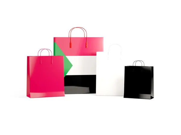 Bandeira do sudan em sacos de compras — Fotografia de Stock